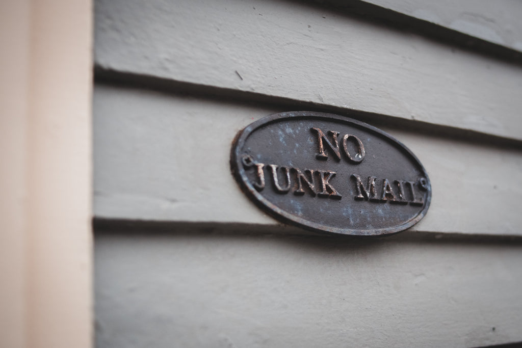 A sign on a house that says “No Junk Mail”