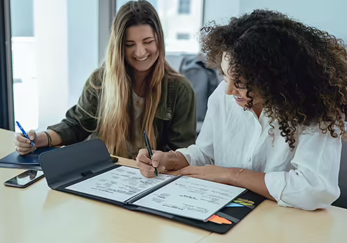 coworkers jotting down notes